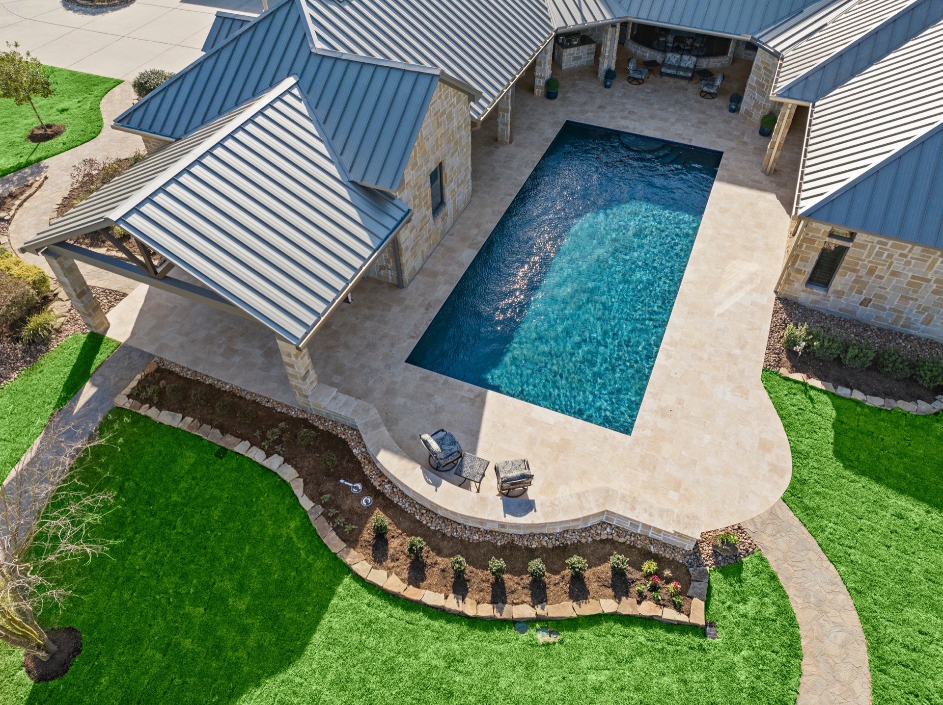 A residential backyard swimming pool at a North Texas home